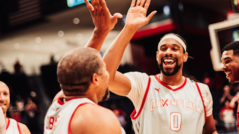 Jeff Gibbs high-fiving Jared Sullinger after his game-sealing shot